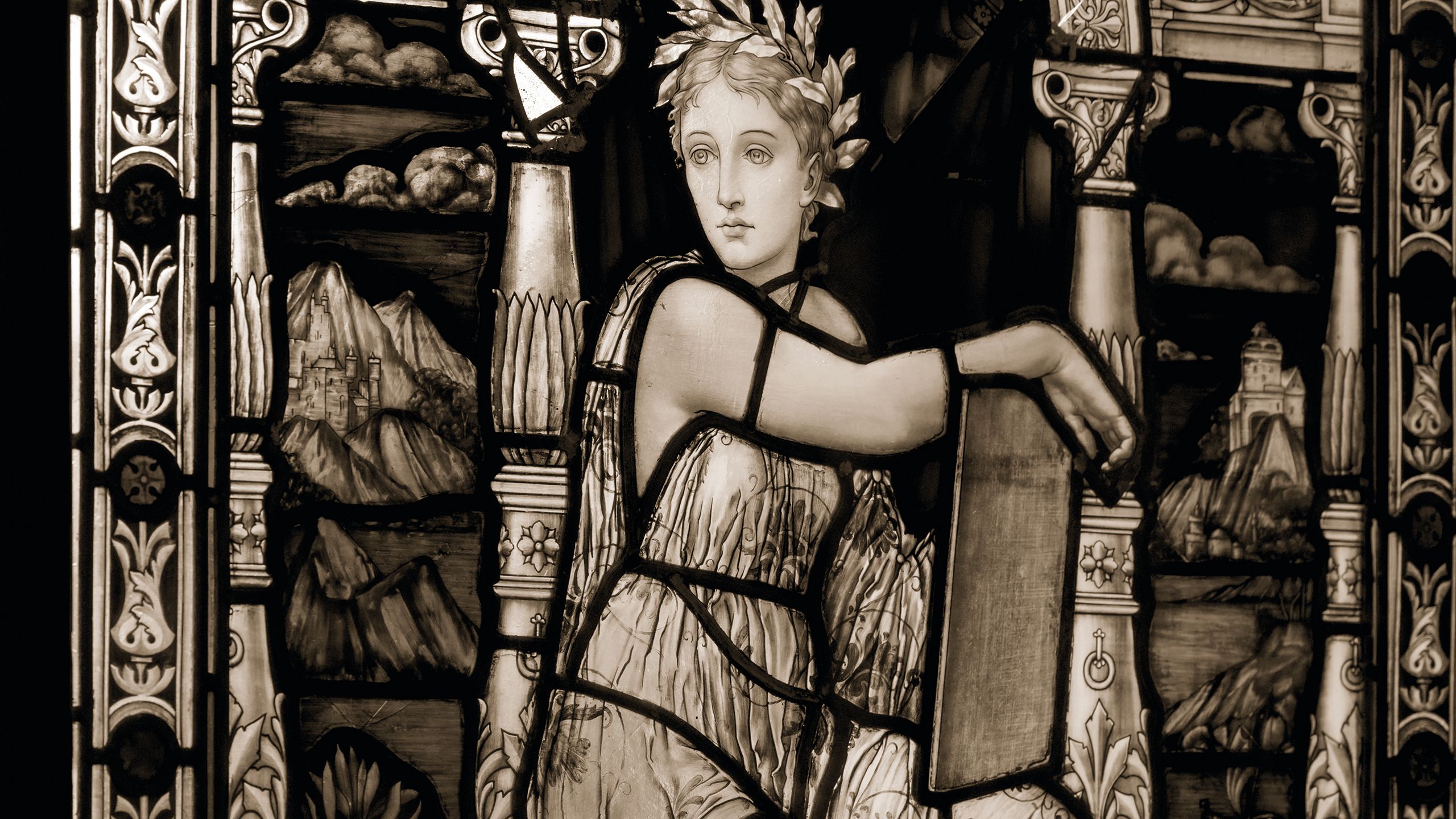 A female figure depicted in stained glass window in the Queen's Tower