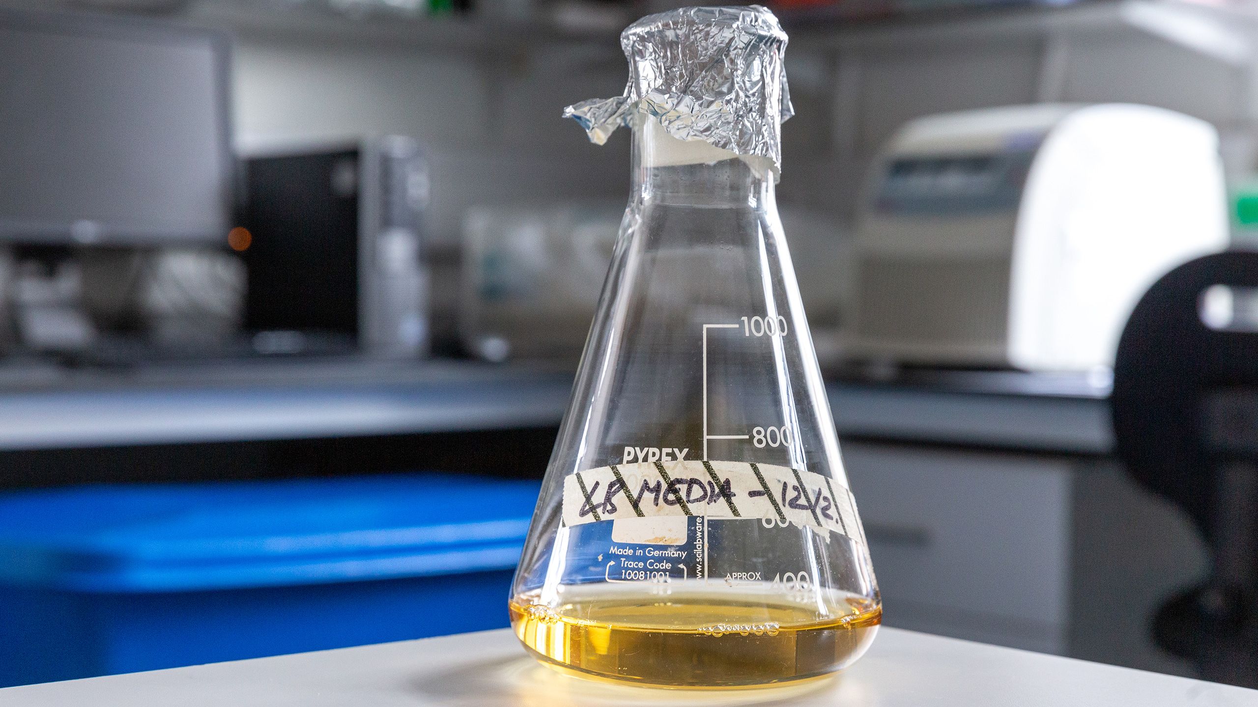 A beaker filled with the vaccine broth in the lab
