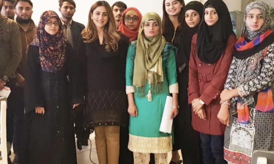 Alumnus Alizeh Atif stood with some of her students