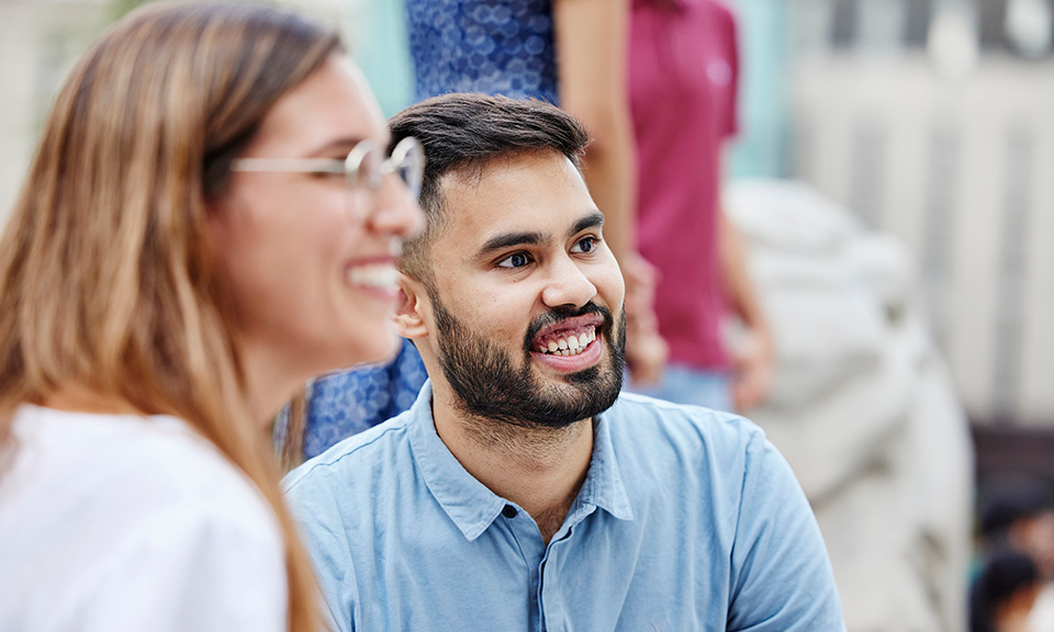 Two Imperial College Business School students smiling