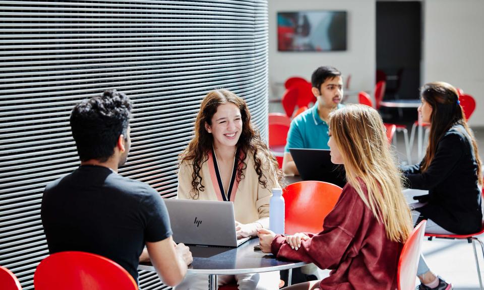 Students sitting in Imperial College Business School Cafeteria