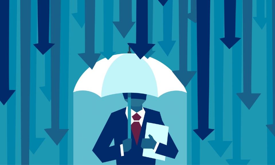 Businessman with umbrella protecting himself from falling arrows