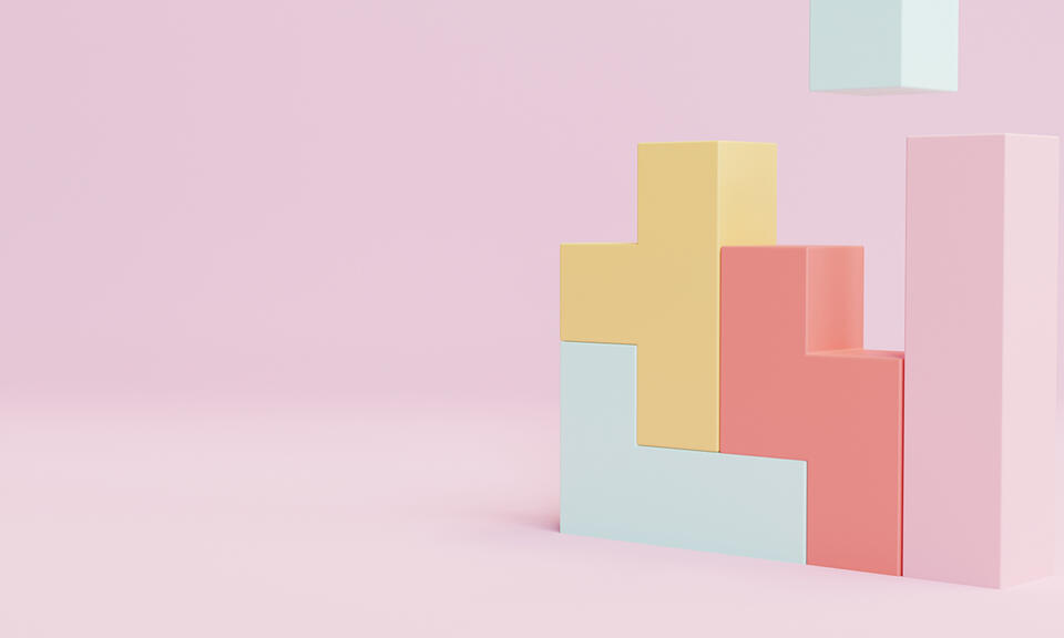 A 3D illustration of pastel-coloured blocks stacked on a pink background, with one block floating above the others