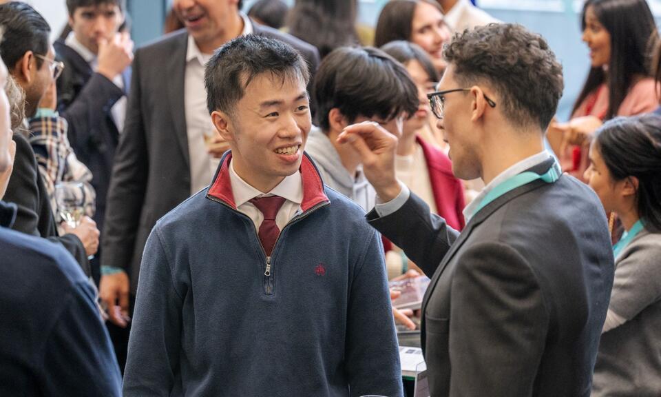 Two event attendees mingling