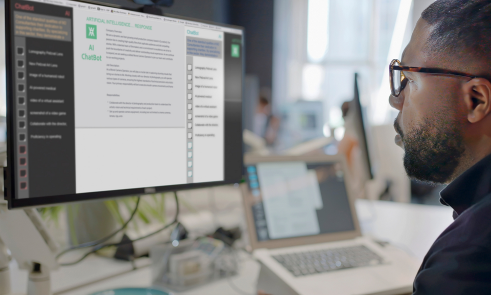 Worker looking at AI Chatbot output on computer screen in the office