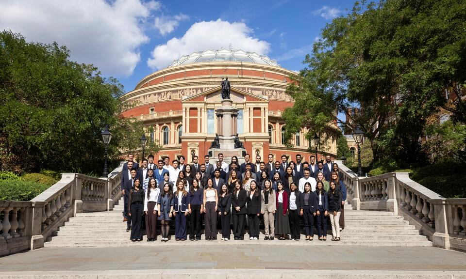 Imperial Business School Full-Time MBA Class of 2027 standing on the steps outside of the Royal Albert Hall