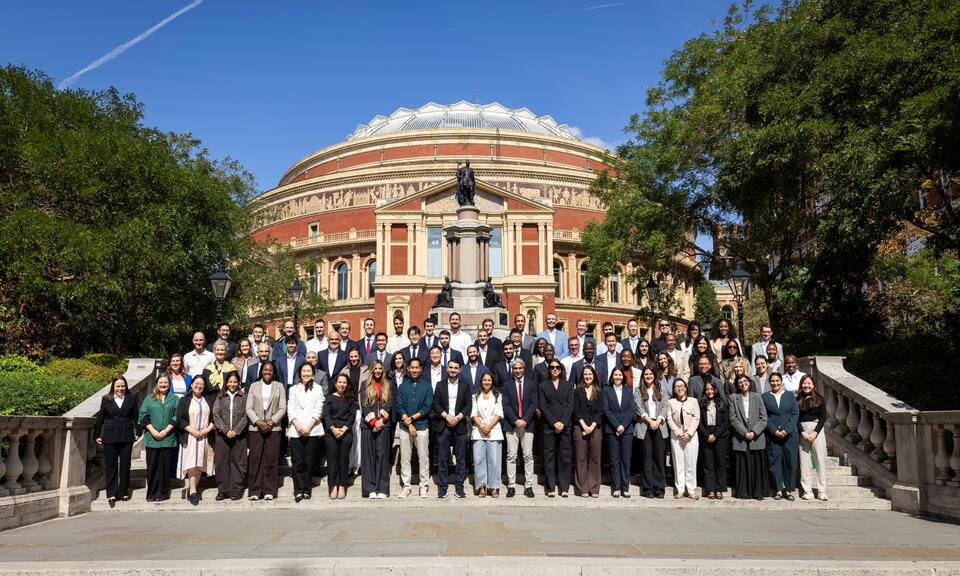 Imperial Business School's global online MBA class of 2028-2029 stand on the steps of the royal albert hall
