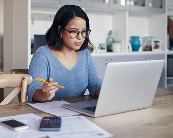 Female student on laptop studying for the GMAT