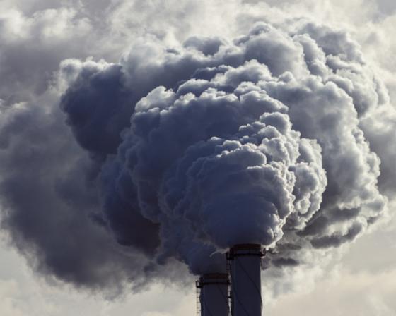 Smoke billowing out of chimney stacks