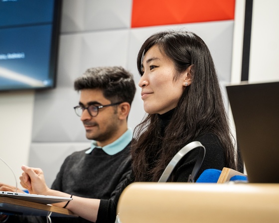 Full-Time MBA Student Smiling in a lecture