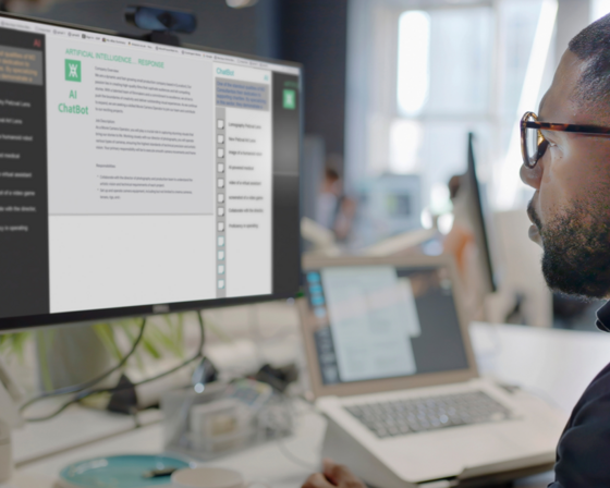 Worker looking at AI Chatbot output on computer screen in the office