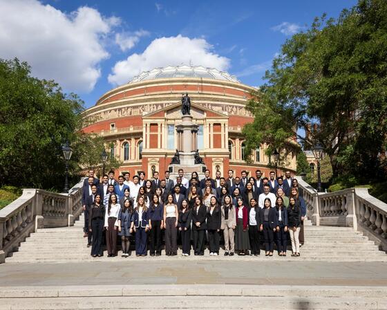 Imperial Business School Full-Time MBA Class of 2027 standing on the steps outside of the Royal Albert Hall