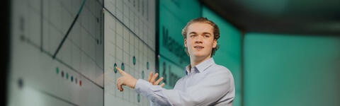 Imperial MSc Strategic Marketing (online, part-time) student on campus in London presenting in a lecture theatre