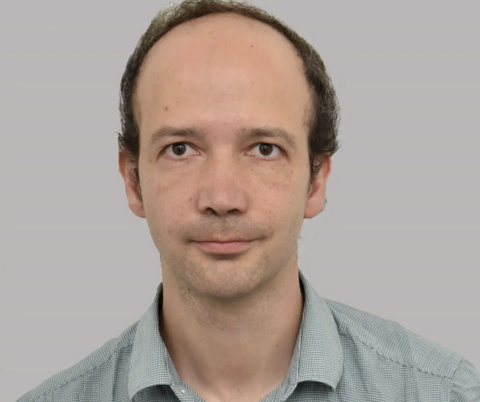 Man standing on grey backdrop