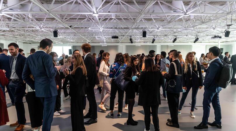 Group of Imperial Full-Time MBA students networking at an event 