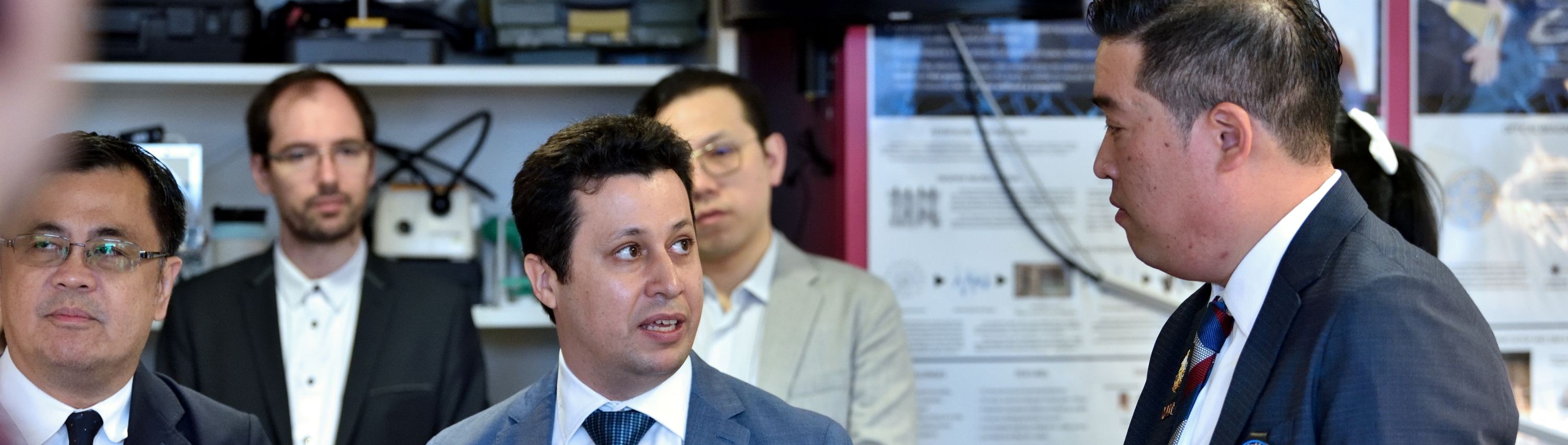 Profs Georgiou and Pookaiyaudom talking in a lab