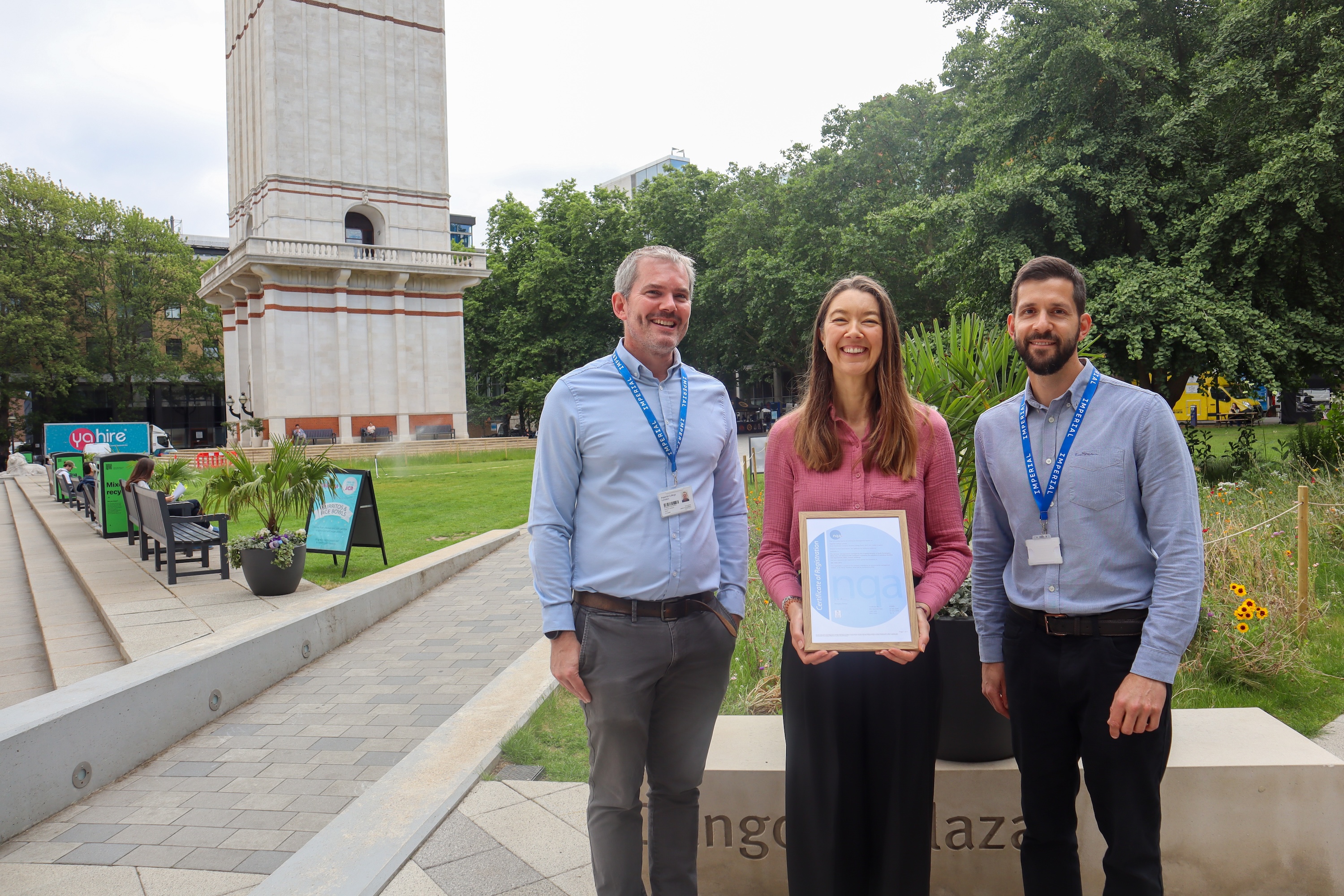 Mark Wilkinson, Lisa Holland and Alex Hobbins at Dangoor Plaza with Imperial's EMS certificate.