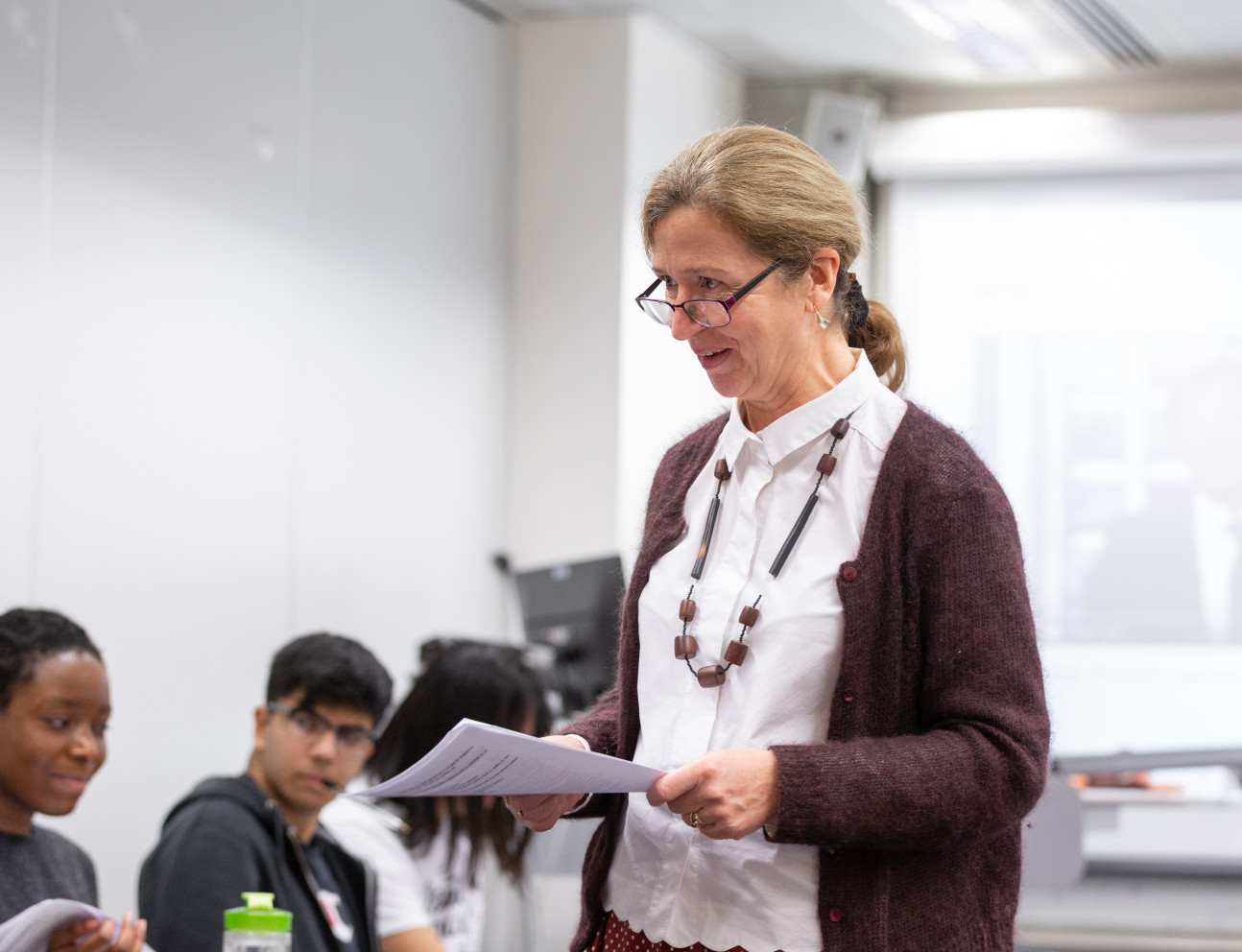 Teacher leading French class