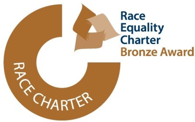 Bronze circular logo with text reading Race Equality Charter Bronze award