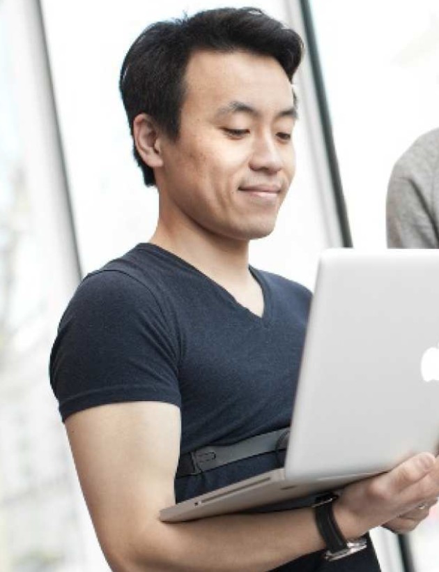 Imperial male student using laptop