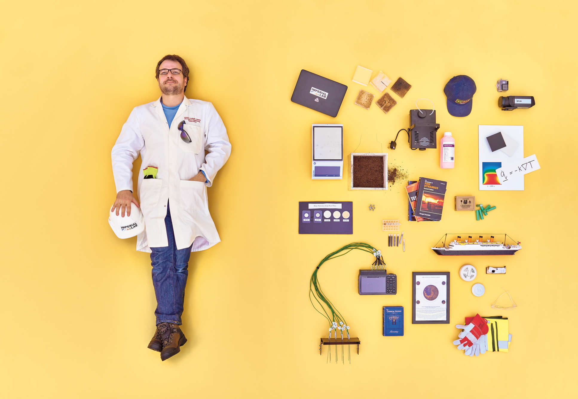 Professor Guillermo Rein surrounded by his research equipment and souvenirs