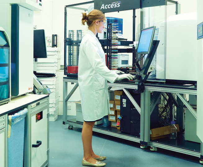 A scientist working at a computer in a lab