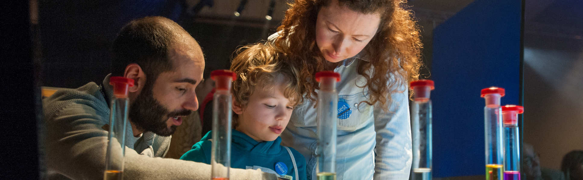 Members of the public look at chemicals with an Imperial researcher