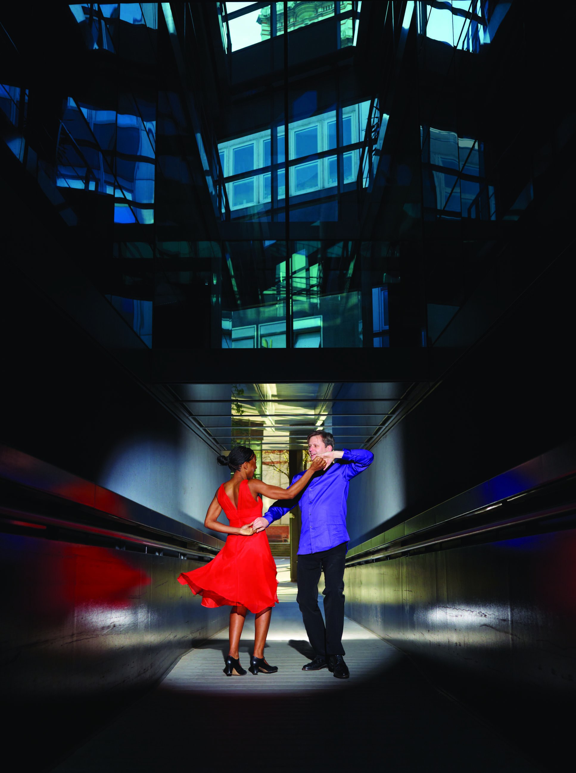 Prof Martin McCall dancing with his partner under the Faculty Building