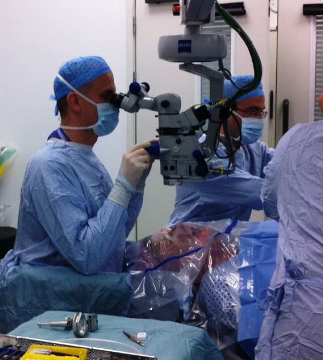 Pofessor Miguel Sebra looking in a microscope