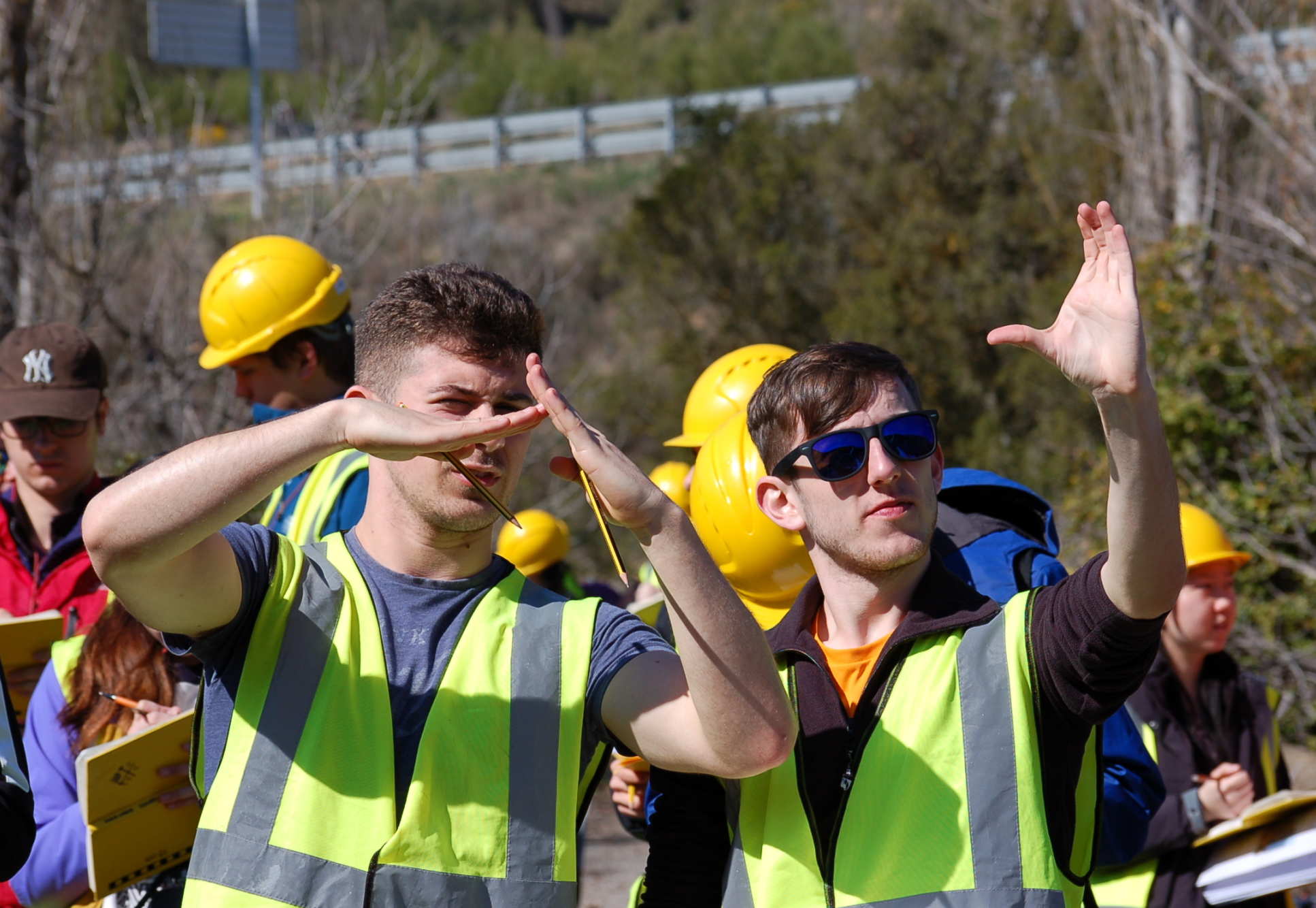 Students in fluorescent vests look at geological features during the 2017 field trip to the Pyrenees 