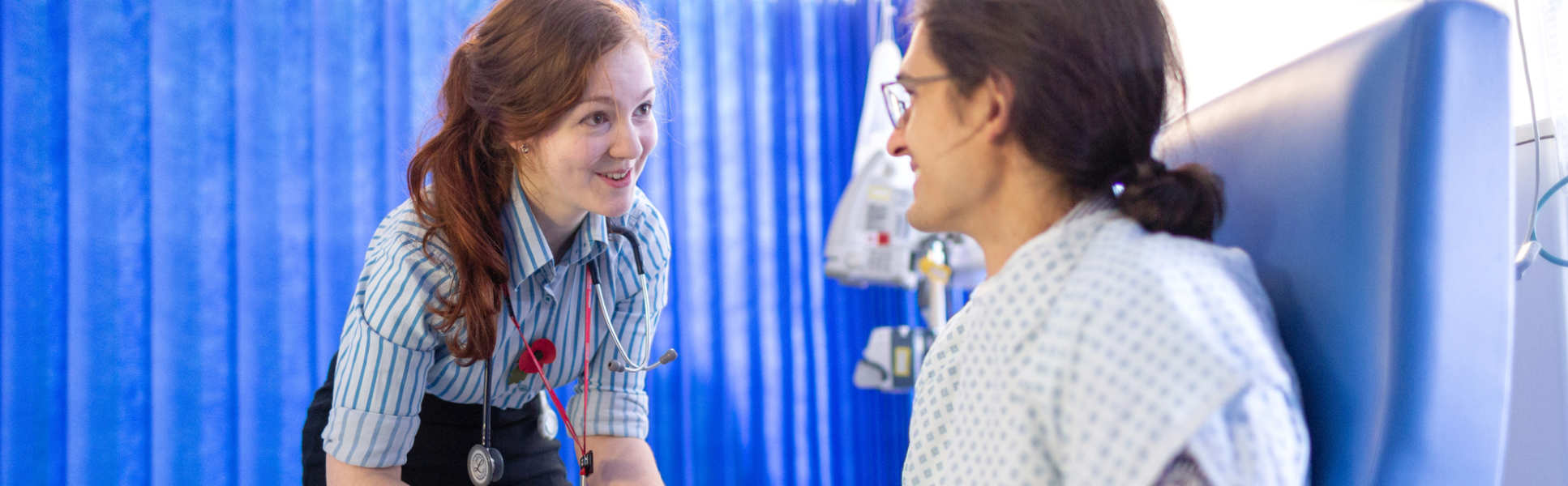 Doctor speaking with patient in hospital