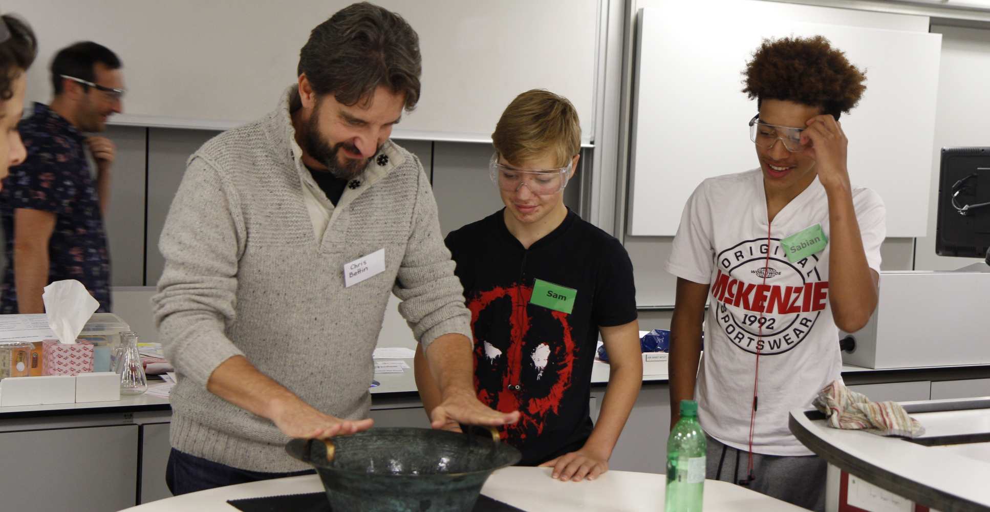 researcher demonstrates in lab