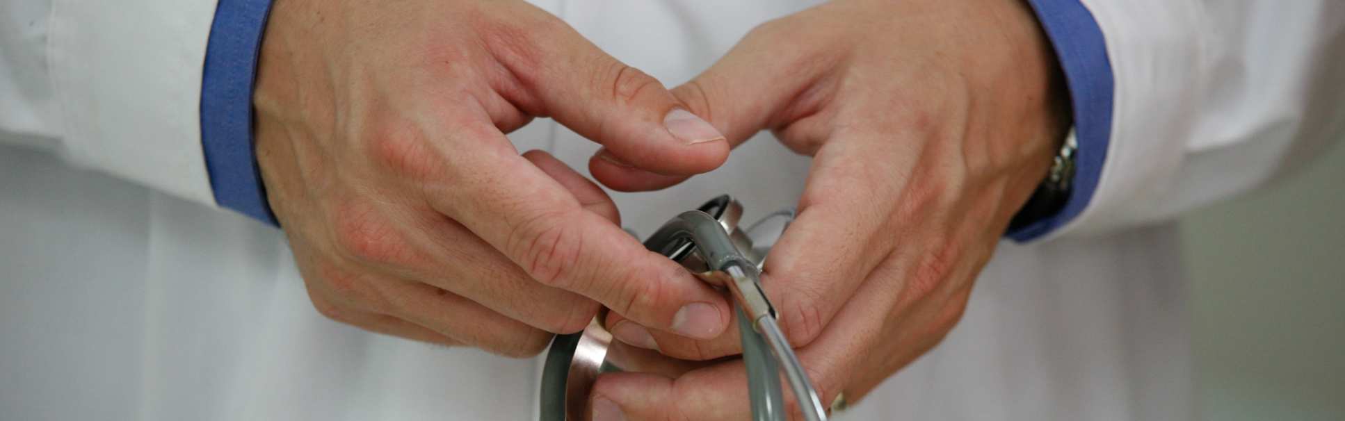 Doctor's hands holding a stethoscope