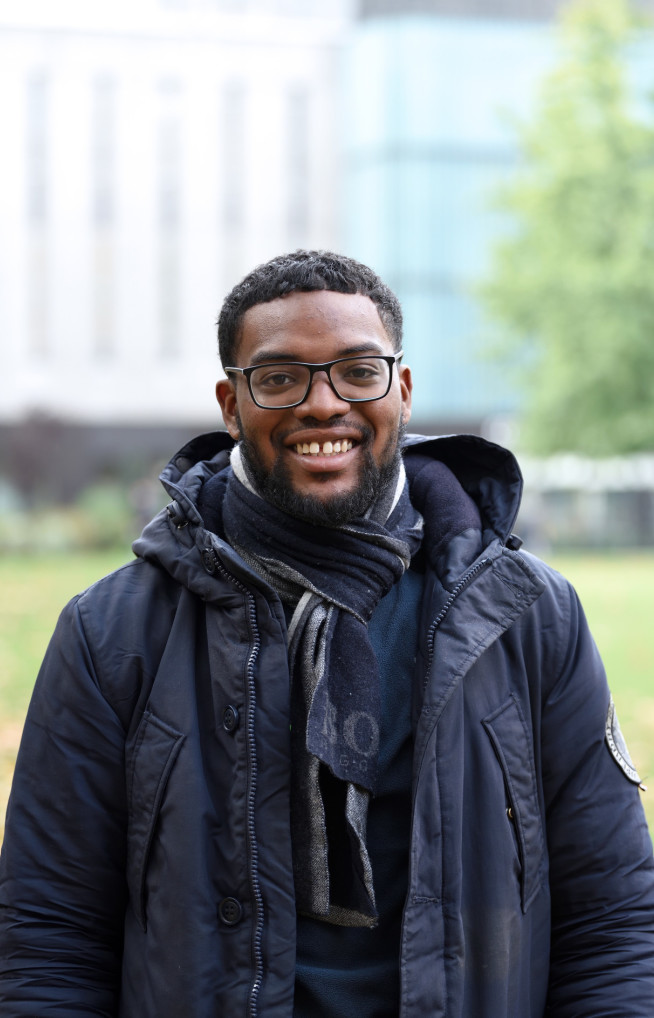 Student smiles at the camera