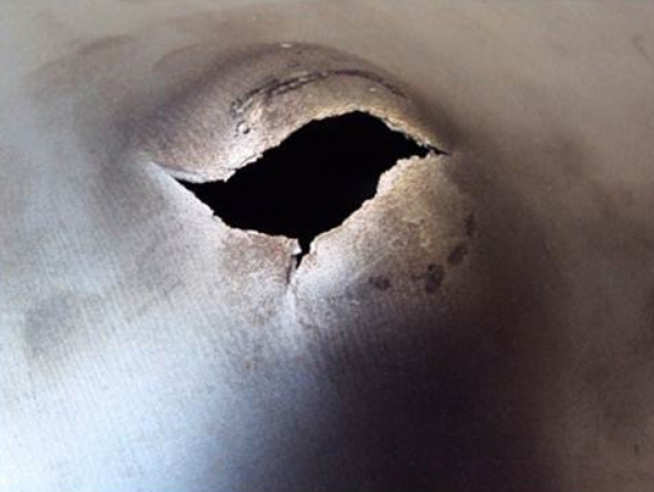 Fig. 1: Rupture in Armour steel panel after localised blast