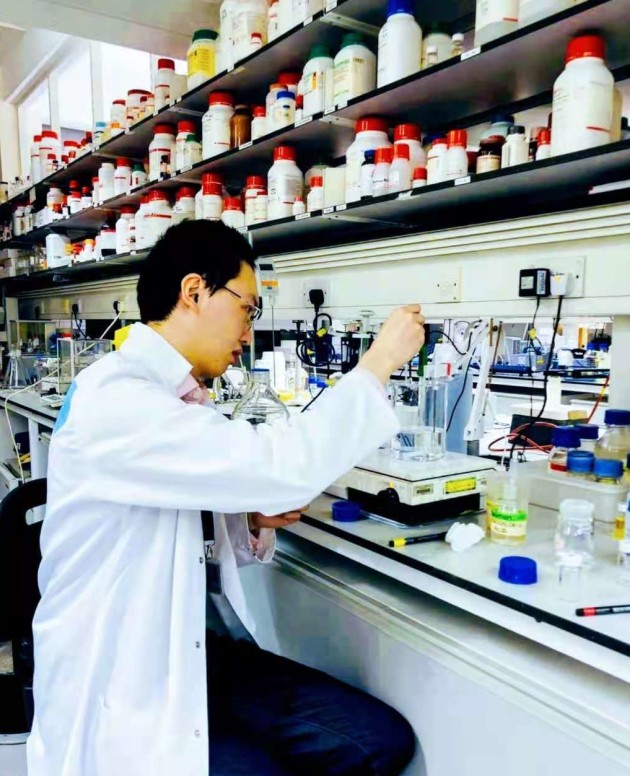 David working at the lab bench