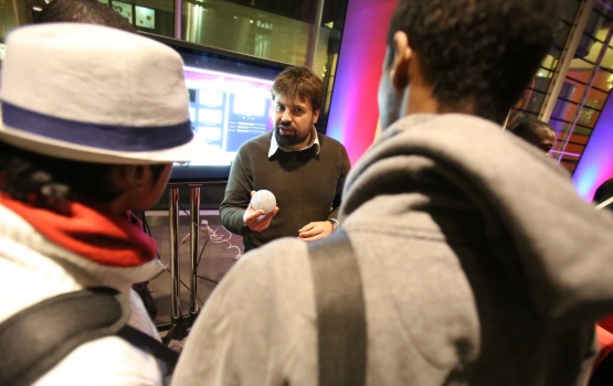 Dr Richard Abel shows 3D model of bone structure to visitors