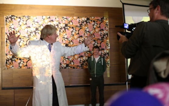 Boris Johnson becomes 'see-through'. The cloak's inventor, Professor Sir John Pendry, standing behind him, was visible through Boris' lab coat.