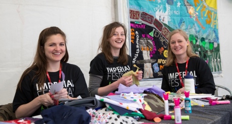 Volunteers help out at the Workshop Tent, which included poetry, ugly animals, quilting and trying out what it's like to be a GP