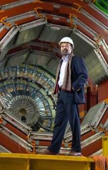 Man standing in front of large science equipment