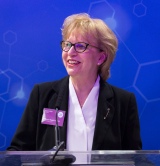 woman talking at lectern