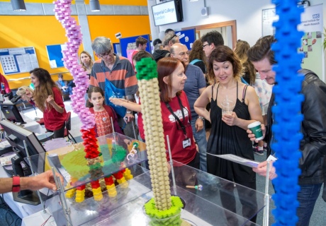 people talking in front of exhibition stand