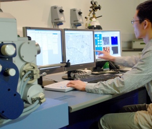 Researcher operating a computer in a lab