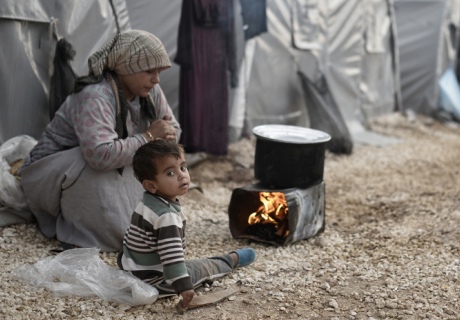A Syrian mother and child living in a refugee camp