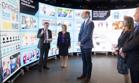 The Duke of Cambridge is briefed about the Heads Together campaign