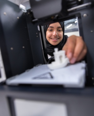 A student using a 3D printer