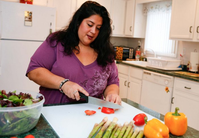 overweight woman preparing salad
