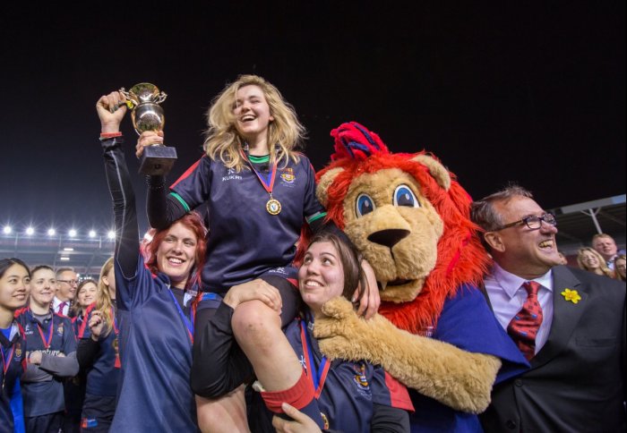 Alice Liberman, Captain of the Imperial College Women's Rugby 1st team, collects the Varsity trophy