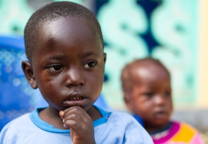 A child who lost members of his family to Ebola in Guinea