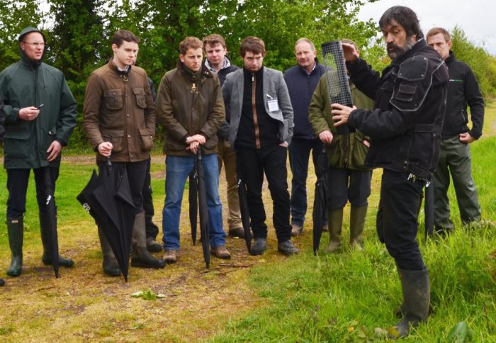 Farmers listen to a researcher